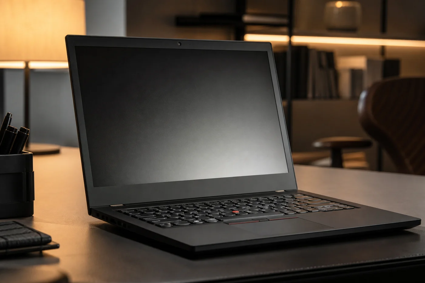 Lenovo ThinkPad X1 Carbon Gen 12 laptop on office desk for Windows remote work digital nomad