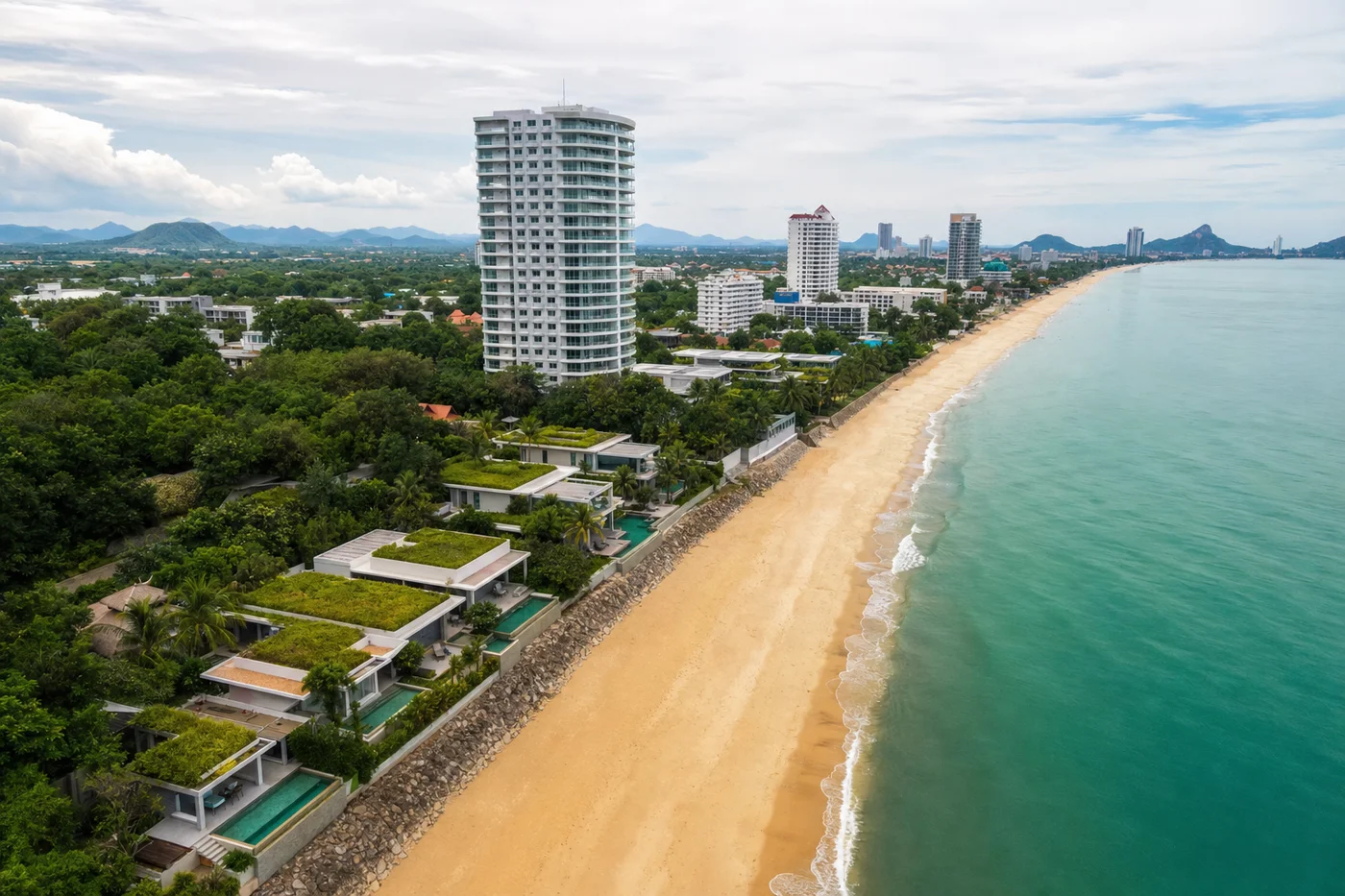 Hua Hin beachfront with luxury villas and condos at golden hour