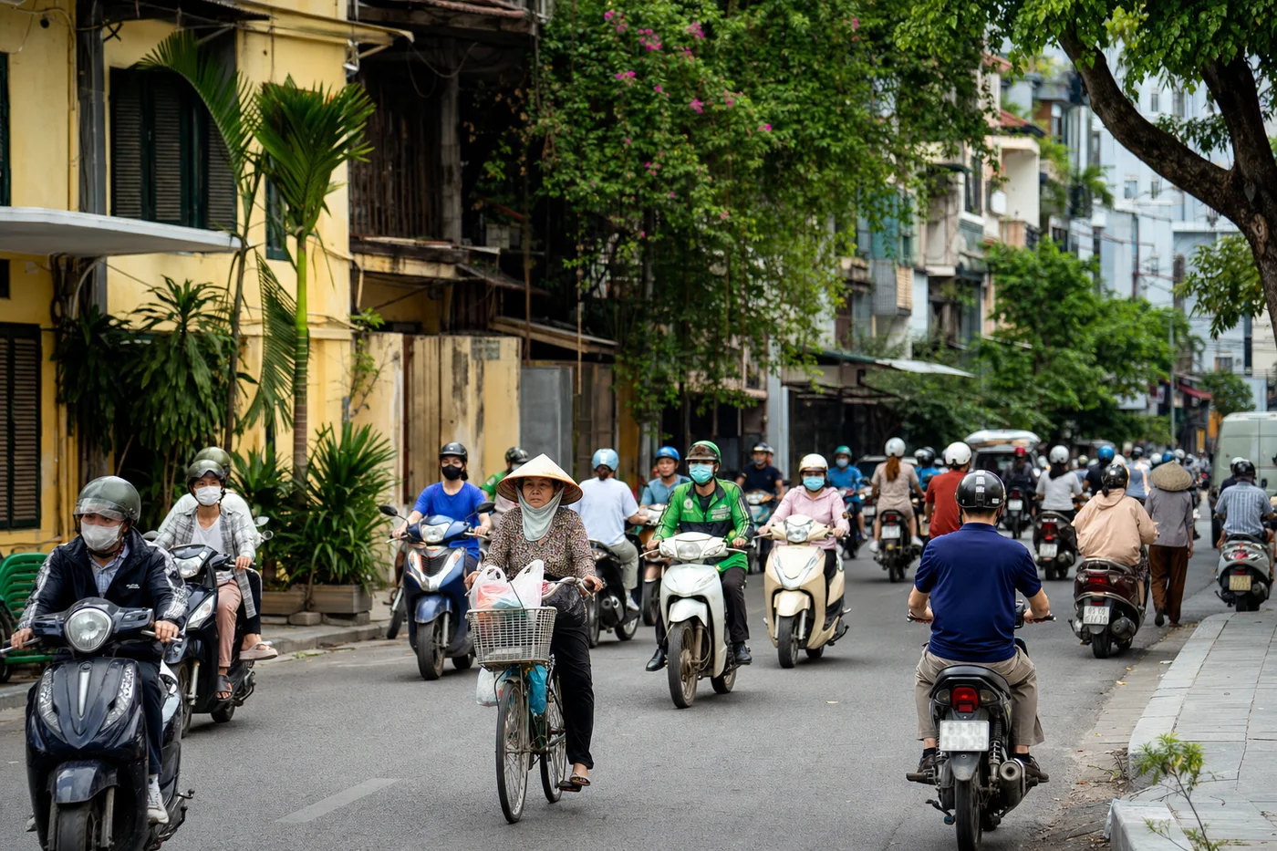 Vietnamese street scene with motorbikes and colorful buildings