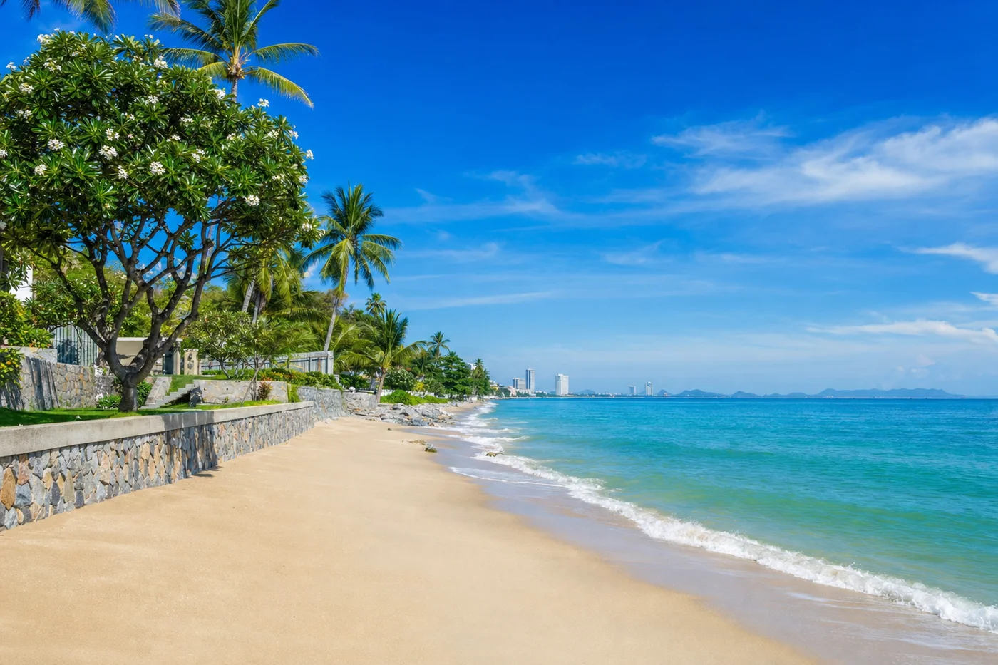 Beautiful sunny day at Hua Hin beach with clear blue sky and calm ocean
